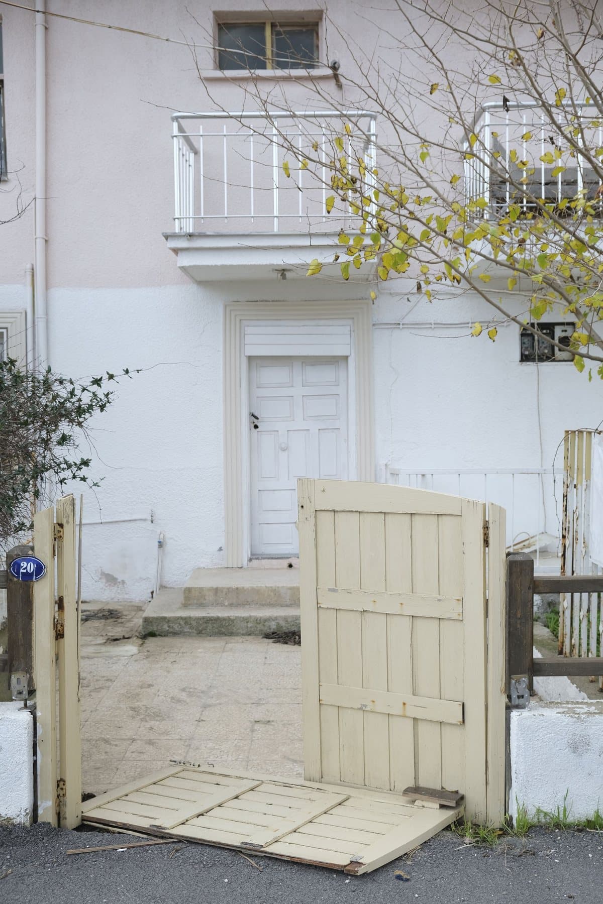Broken wooden gate at a residential property