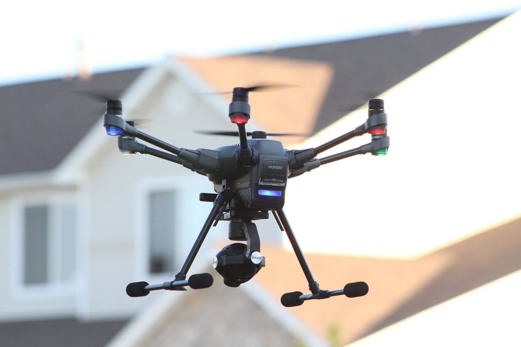 Drone flying near a residential home during an exterior property inspection