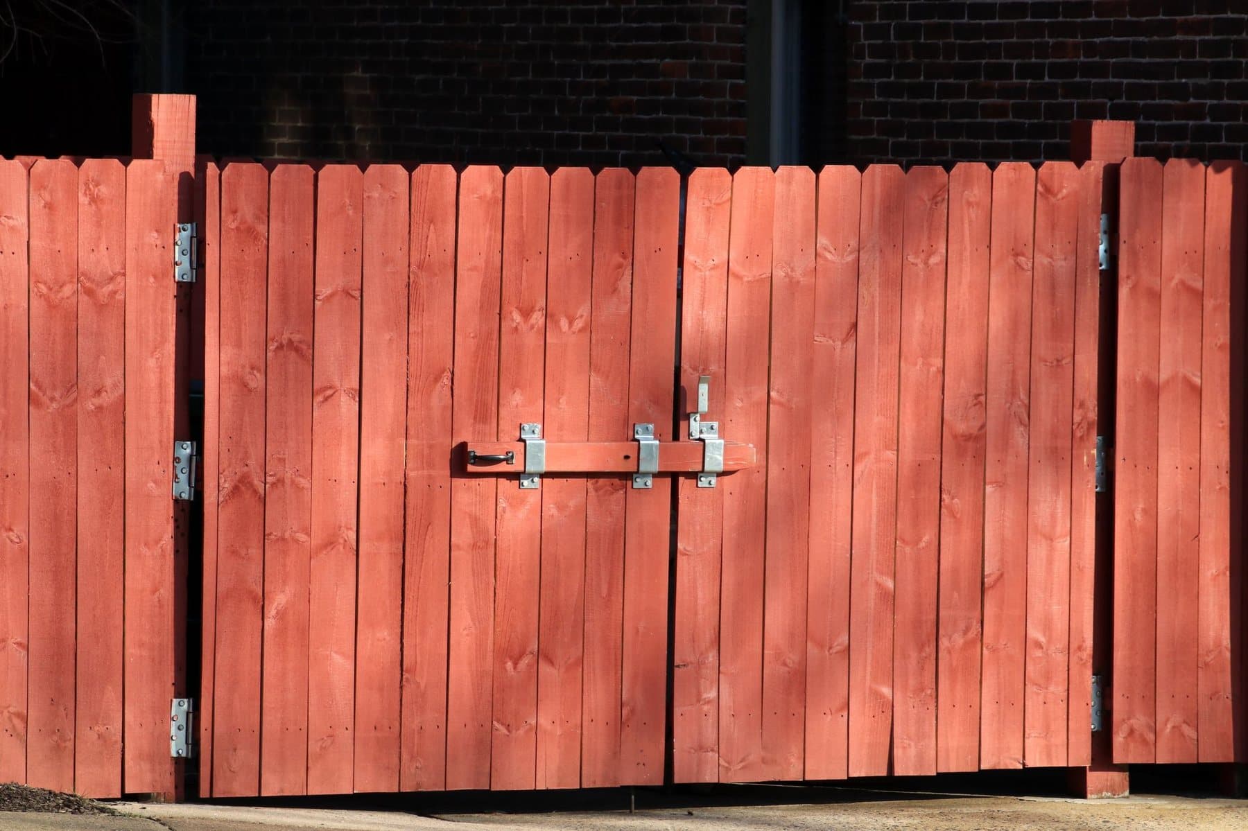 Secure wooden gate latch after routine property maintenance