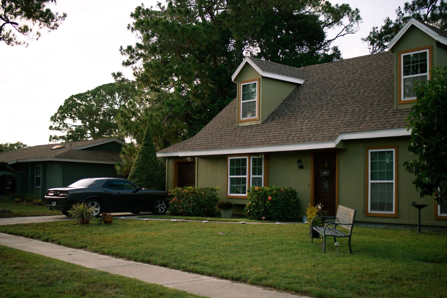 Suburban rental home with a maintained lawn and driveway